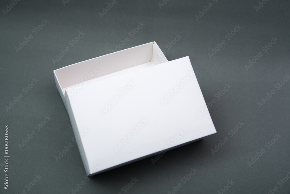 Empty Package white cardboard box or tray for product on grey background. Empty Package white cardboard box or tray for product on grey background.