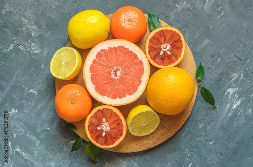 Fresh citrus fruits on table, top view. © Maksim
