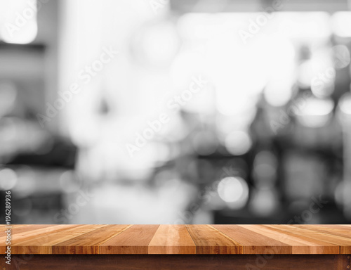 Empty wood table top with blurred black and white cafe background. Mock up for display or montage of product Business presentation