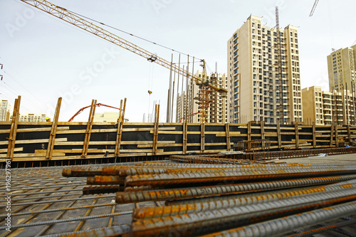 Wallpaper Mural worker in the construction site making reinforcement metal framework for concrete pouring Torontodigital.ca