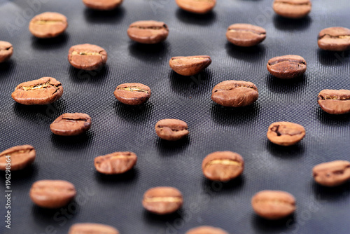 Coffee beans on the dark stone background