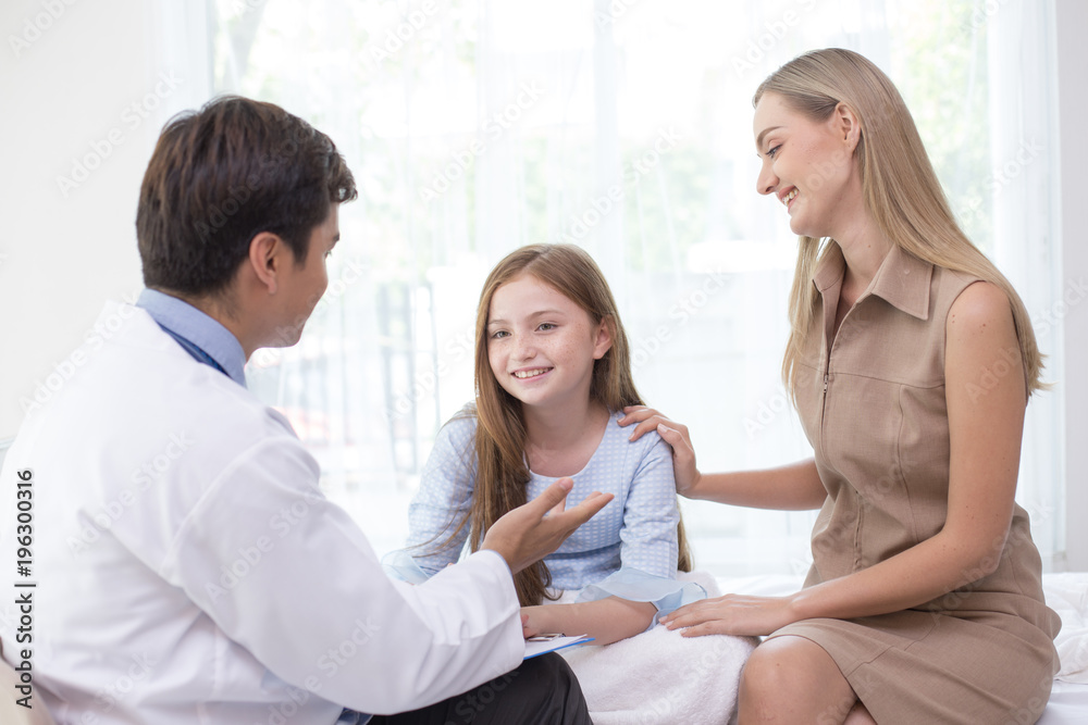 Doctor visit to little patient at hospital with happy emotion together. People with health care and medical concept. Doctor visit to little patient at hospital with happy emotion together. People with health care and medical concept.