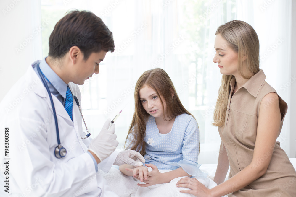 Girl scary to injection from doctor at hospital. People with medical and health care concept. Girl scary to injection from doctor at hospital. People with medical and health care concept.