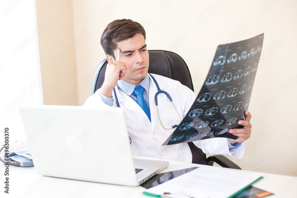 Portrait of Dooctor holding films x-ray and checking at hospital. People with medical concept. Portrait of Dooctor holding films x-ray and checking at hospital. People with medical concept.