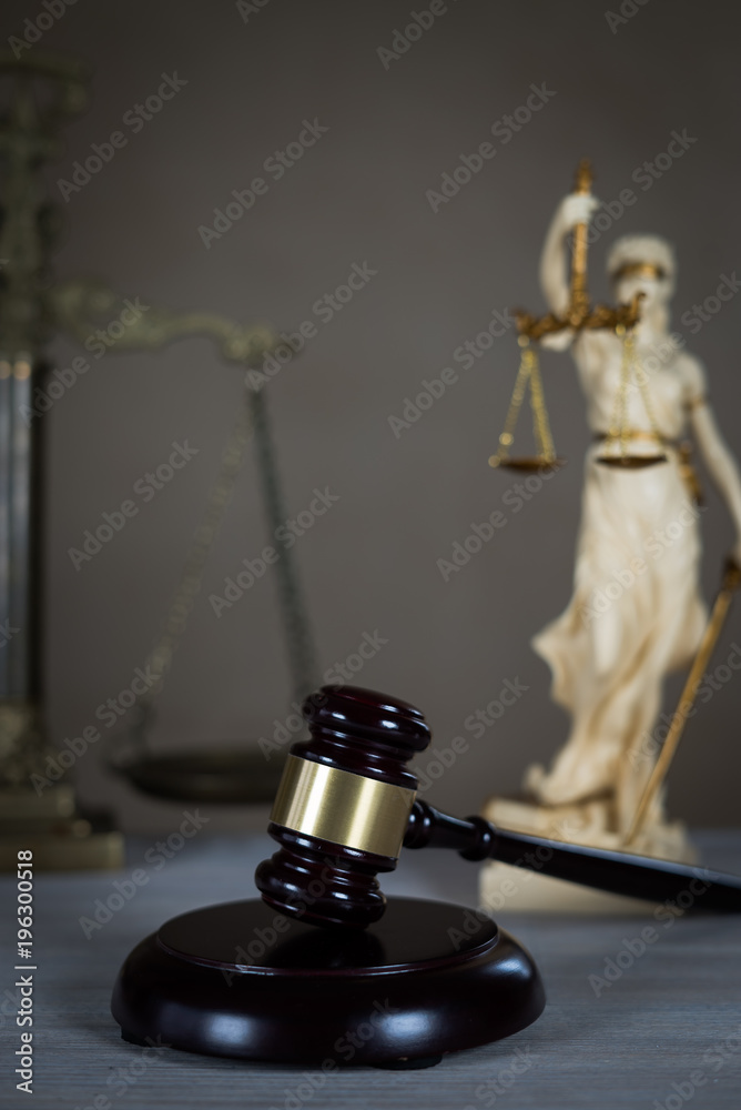 Law and Justice concept. Mallet of the judge, books, scales of justice. Gray stone background, reflections on the floor, place for typography. Courtroom theme. Law and Justice concept. Mallet of the judge, books, scales of justice. Gray stone background, reflections on the floor, place for typography. Courtroom theme.