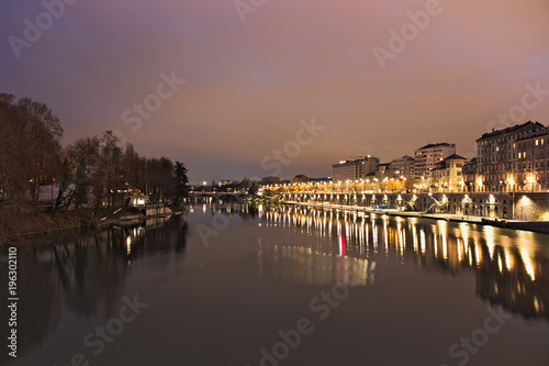 Po river flowing in Torino city, Italy, Murazzi docks, night view © Marco