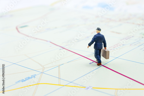 miniature businessman people walking on the map, travel concept