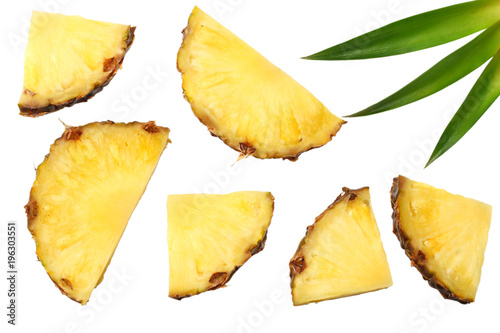 healthy background. pineapple slices with green leaves isolated on white background top view