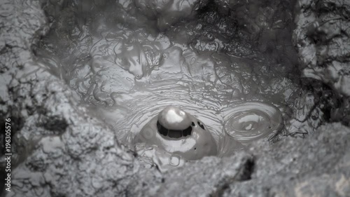 Extremely slow frame rate, close up of mud bubbling in NZ.