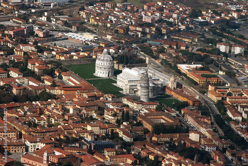 Magnificent view from the plane to the center of Pisa and the square with the falling tower in clear weather