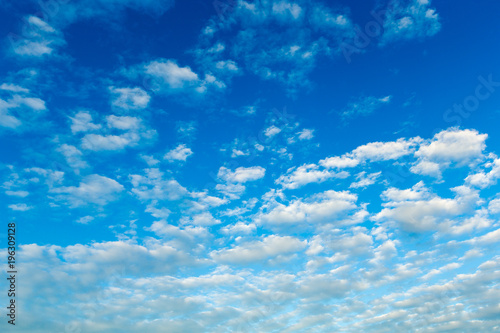 blue sky background with tiny clouds