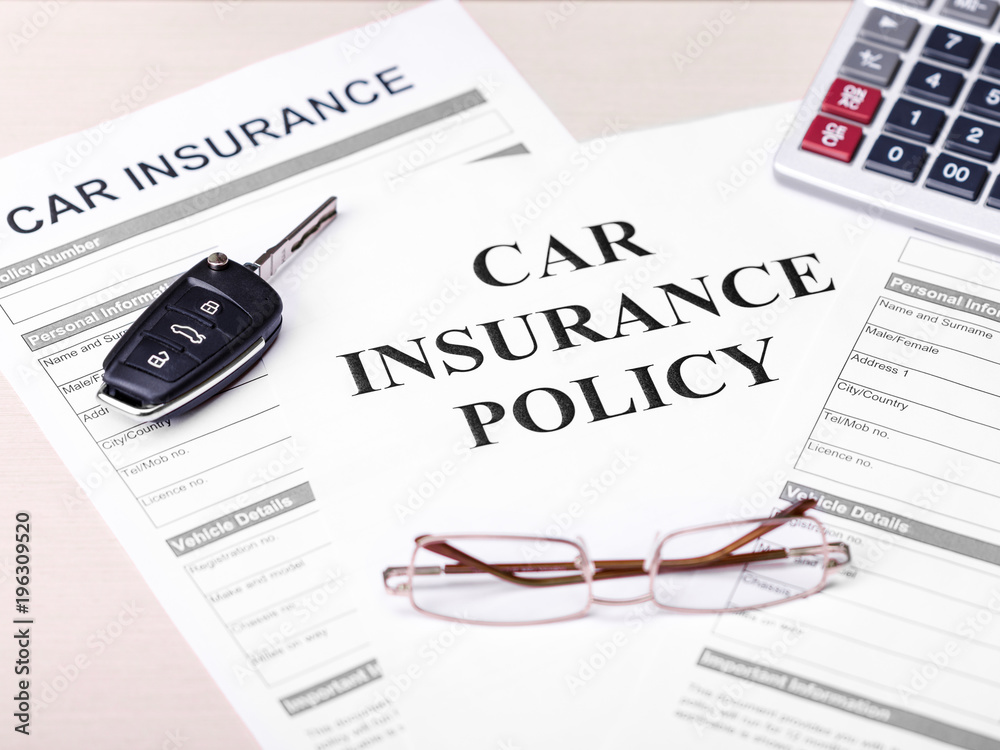 Car insurance policy. Document, key, glasses on table. Business and insurance background concept. Car insurance policy. Document, key, glasses on table. Business and insurance background concept.