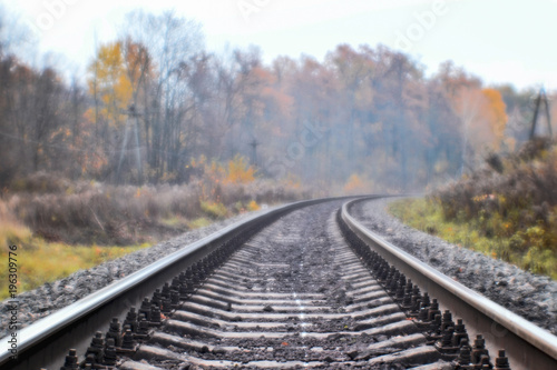 Soft blur photos taken on the soft lens. Railroad in autumn stretches into the distance.