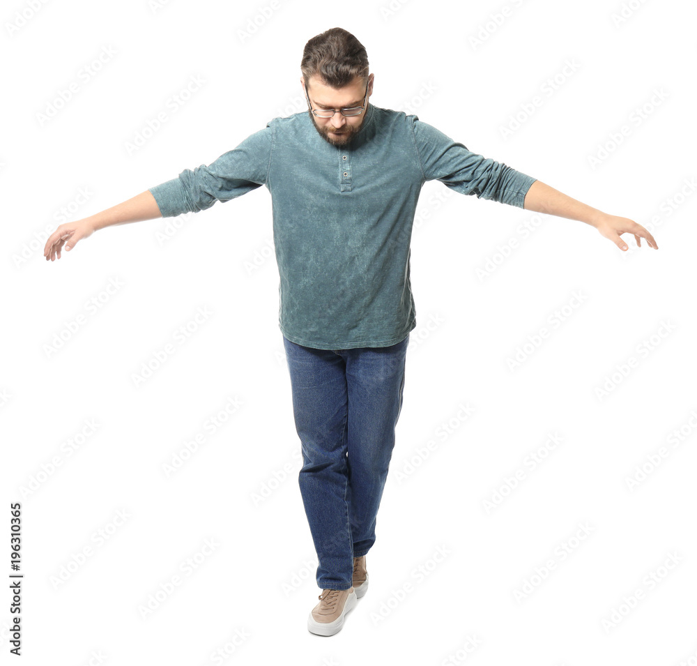 Young man balancing on white background Young man balancing on white background