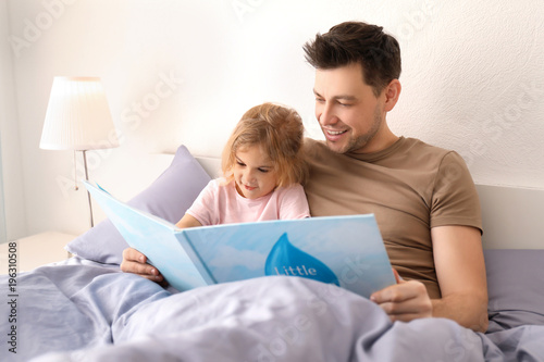 Father with little daughter...