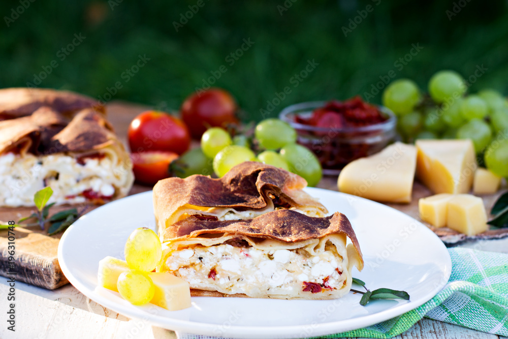Strudel with cheese and sun-dried tomatoes.