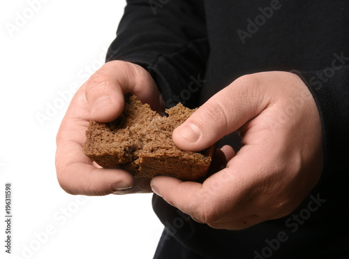 Poor man with little piece of bread, isolated on white