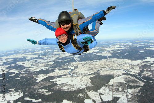Skydiving. Tandem jump with pretty girl.