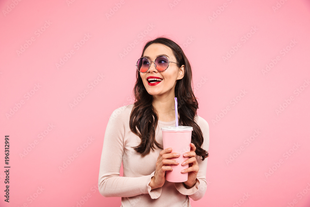 Cute happy girl with red lips over pink background. Cute happy girl with red lips over pink background.