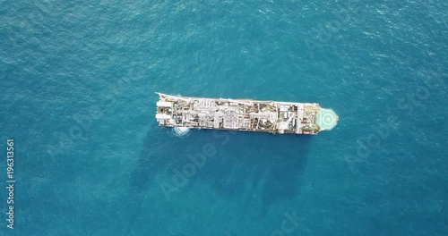 Aerial view of an offshore oil installation and supply ship
