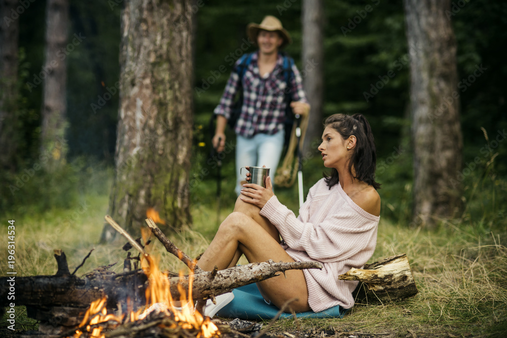 Couple in love at picnic with fire in forest, Couple in love at picnic with fire in forest,