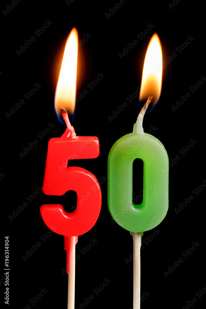 Burning candle in the form of five figures (numbers, dates) for cake isolated on black background. The concept of celebrating a birthday, anniversary, important date, holiday, table setting Burning candle in the form of five figures (numbers, dates) for cake isolated on black background. The concept of celebrating a birthday, anniversary, important date, holiday, table setting
