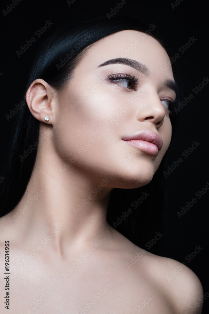 Portrait of a young girl with lush lips and long eyelashes. Perfect fresh young skin. Portrait of a young girl with lush lips and long eyelashes. Perfect fresh young skin.