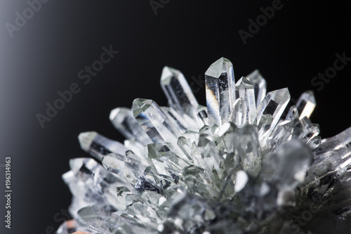 Big natural double quartz crystal isolated on white.