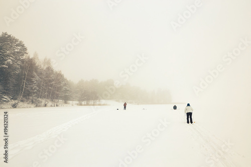 Belarus, Grodno, Lake Molochnoe in the winter. People skiing. © makam1969