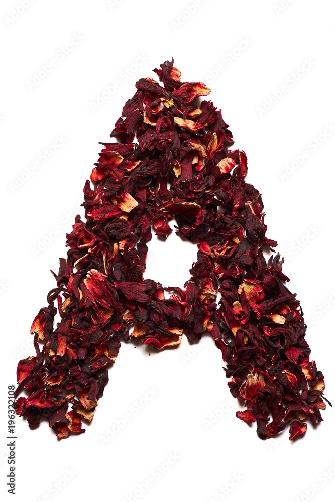 English alphabet. Letter A from dried flowers of hibiscus tea on a white background. Letters for banners, advertisements English alphabet. Letter A from dried flowers of hibiscus tea on a white background. Letters for banners, advertisements