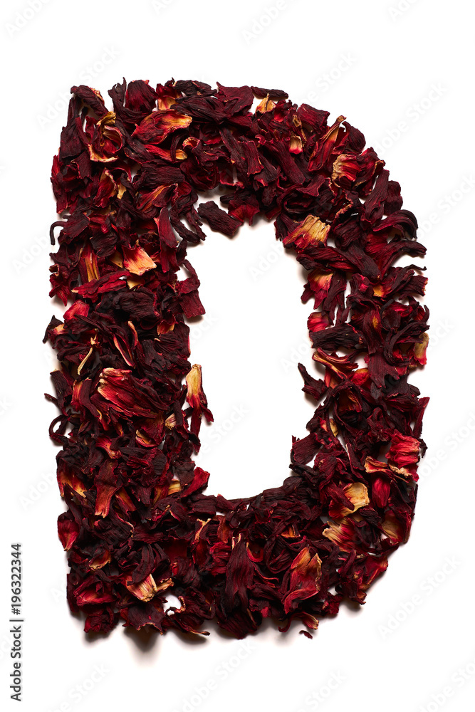 English alphabet. Letter D from dried flowers of hibiscus tea on a white background. Letters for banners, advertisements English alphabet. Letter D from dried flowers of hibiscus tea on a white background. Letters for banners, advertisements