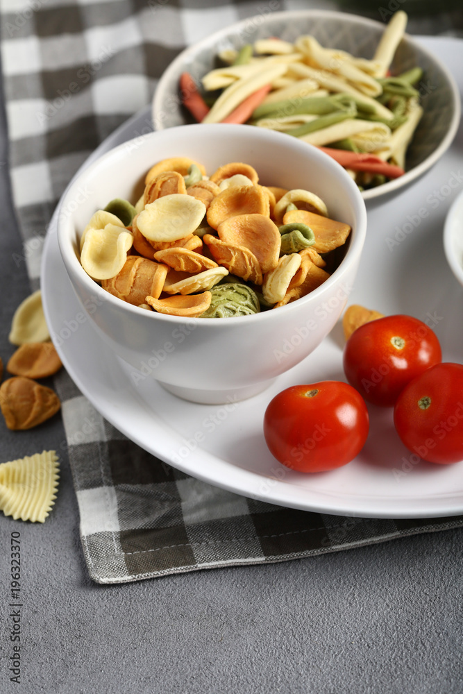 Two types Raw pasta in small bowl