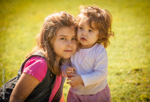 portrait latin sisters in summer park