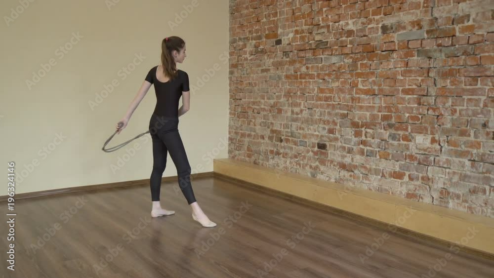 sport fitness. athletic workout. gymnastics calisthenics rope exercise training. artistic performance of young fit teen girl in a studio sport fitness. athletic workout. gymnastics calisthenics rope exercise training. artistic performance of young fit teen girl in a studio