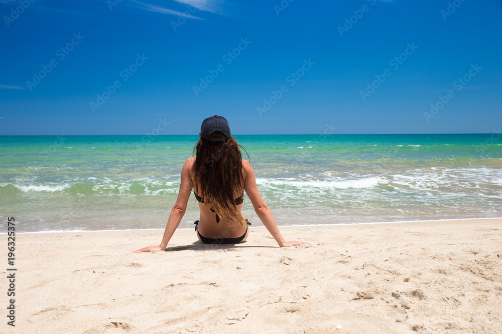  woman relaxes on beach