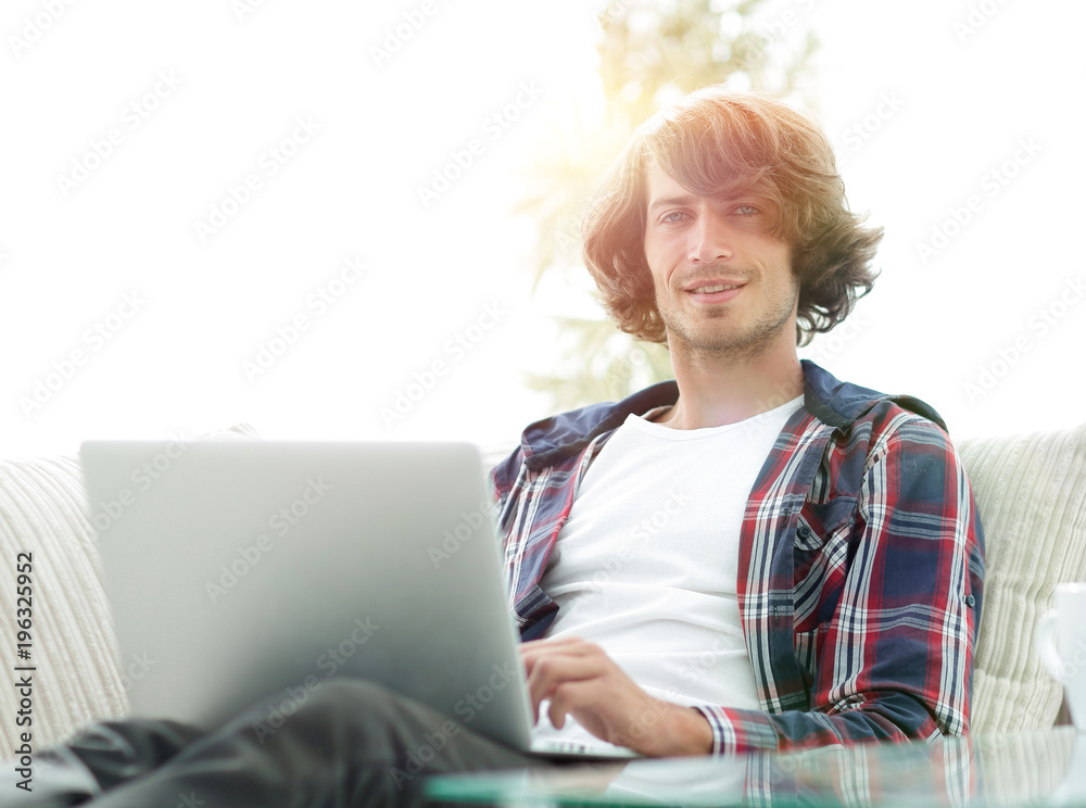 serious guy working sitting near the desktop. serious guy working sitting near the desktop.