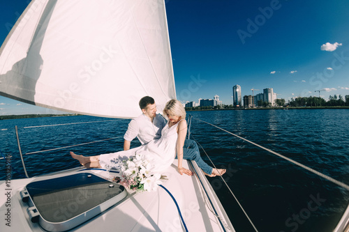 couple in love on a yacht in the summer. © velimir