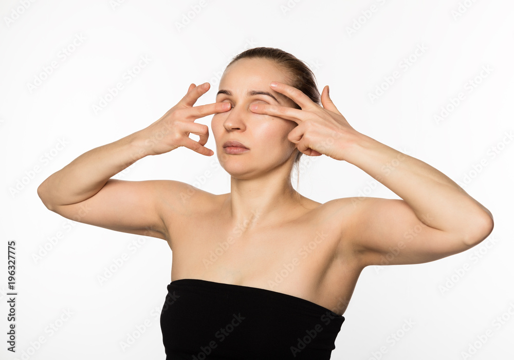 beautiful girl performs anti-aging exercises. face fitness for anti sagging skin beautiful girl performs anti-aging exercises. face fitness for anti sagging skin