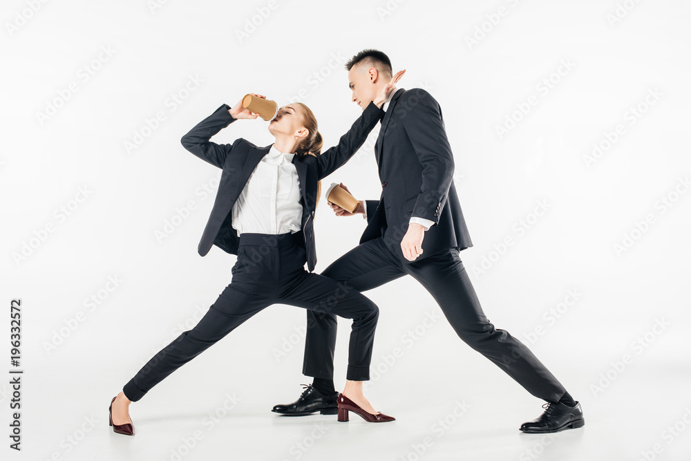 businesspeople fighting and drinking coffee in suits isolated on white businesspeople fighting and drinking coffee in suits isolated on white