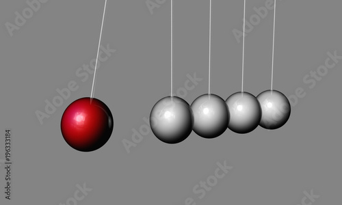 Close-up of red and white Newton's cradle
