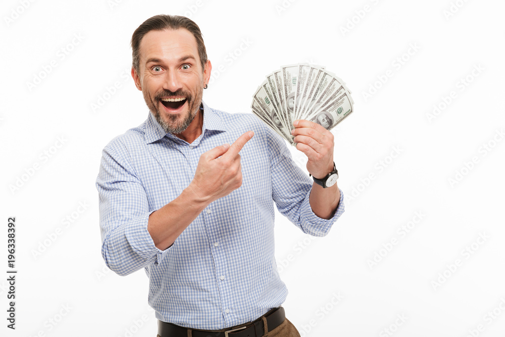 Portrait of an excited mature man dressed in shirt Portrait of an excited mature man dressed in shirt