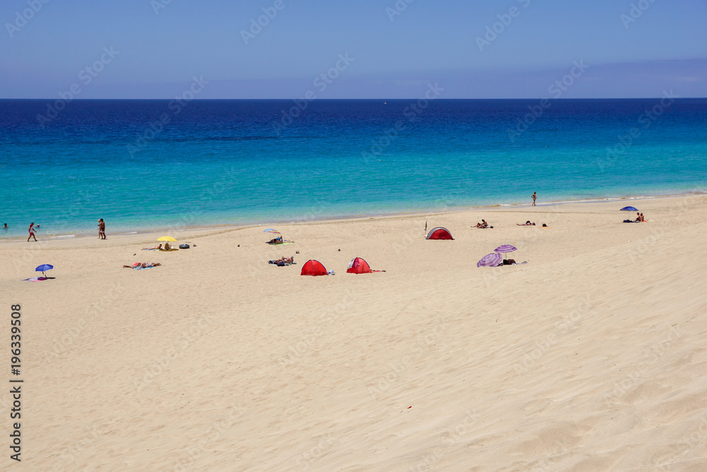 Sand dune and coastal promenade along a beach in Morro Jable town, Fuerteventura, Canary Islands, Spain Sand dune and coastal promenade along a beach in Morro Jable town, Fuerteventura, Canary Islands, Spain