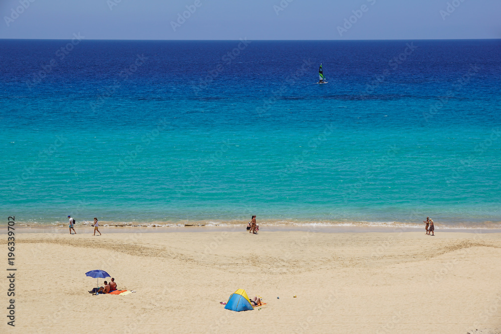 Sand dune and coastal promenade along a beach in Morro Jable town, Fuerteventura, Canary Islands, Spain