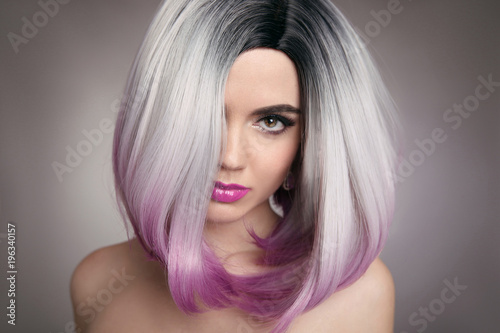 Ombre bob hairstyle blonde girl portrait. Purple makeup. Beautiful hair coloring woman. Fashion Trendy haircut. Blond model with shiny hairstyle. Concept Coloring Hair. Beauty Salon.