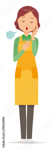 A middle-aged housewife wearing an apron is sighing