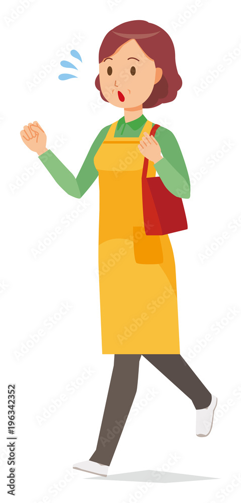 A middle-aged housewife wearing an apron is running with bag A middle-aged housewife wearing an apron is running with bag