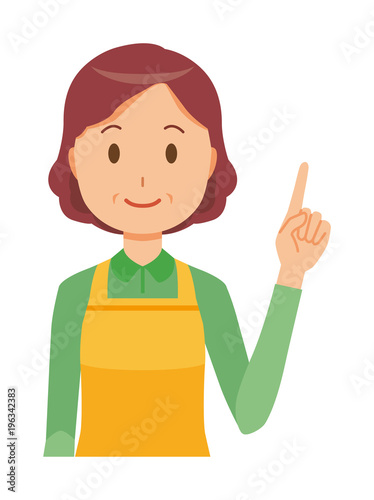 A middle-aged housewife wearing an apron is pointing