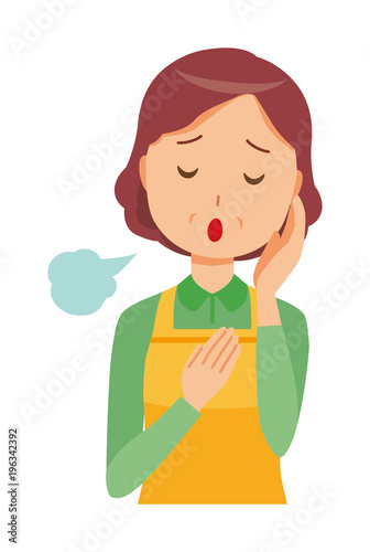 A middle-aged housewife wearing an apron is sighing