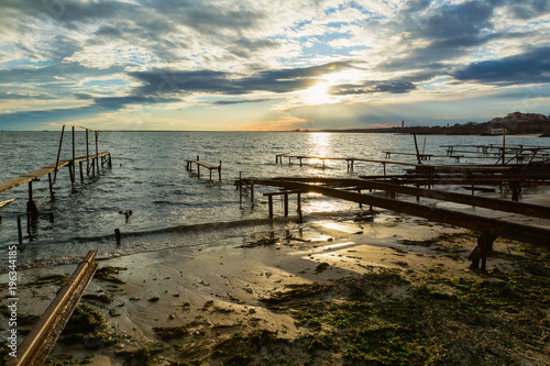 Colorful sunset at the fishing village near Ravda  Bulgaria. Sea sunset at Black Sea coast