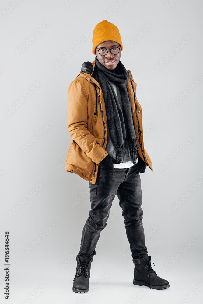 African-American man posing on gray background African-American man posing on gray background